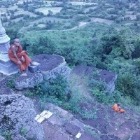 Cambodian monks sit at top of Phnom Chisor