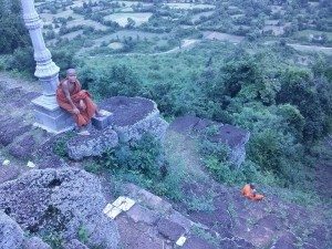 Cambodian monks sit at top of Phnom Chisor